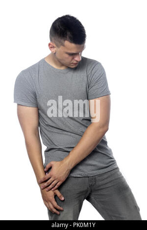 Hübscher junger Mann auf grauem Hintergrund Stockfoto