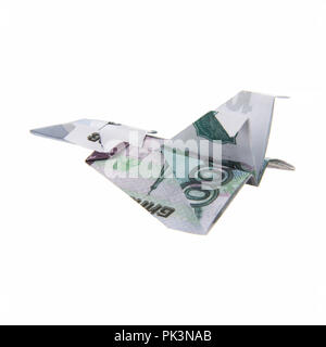 Origami Flugzeug von Banknoten Stockfoto