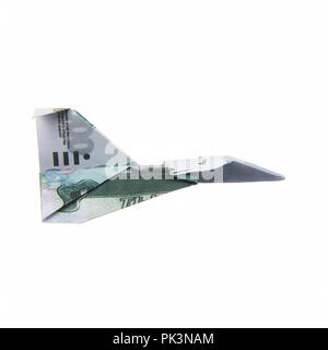 Origami Flugzeug von Banknoten Stockfoto