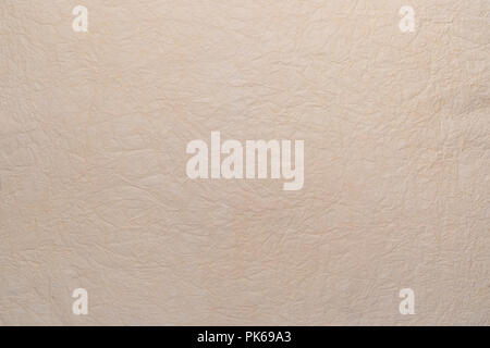 Zerknittertes Papier Textur handgefertigte Pergament Art. In zarten Ocker- und Vanilletönen. Stockfoto