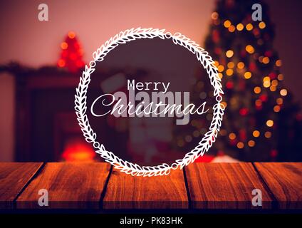 Frohe Weihnachten Text mit warmes Zuhause und Weihnachtsbaum Stockfoto