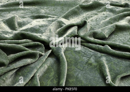 Seide Viskose Gewebe. Velvet mit blauem Muster spritzen auf Grün. Stockfoto