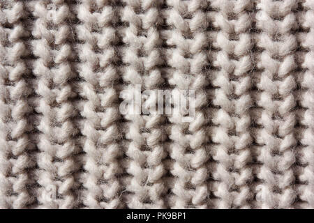 Rustikal beige gestrickte Wolle Hintergrund. Stockfoto