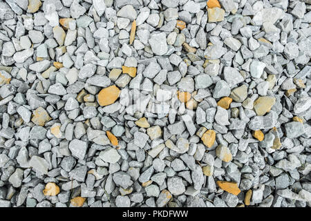 Kies mit weißen und gelben Kies/Textur Hintergrund Stockfoto