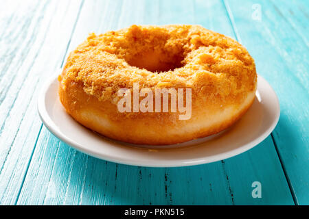 Seite View Studio Schießen von donut mit geschredderten Schweinefleisch auf der Oberseite Stockfoto