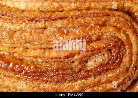 Blick von oben auf die KARAMELLISIERTEN Textur der Französischen Palmier Gebäck oder Elephant Ear Cookie, für Hintergrund oder Banner Stockfoto