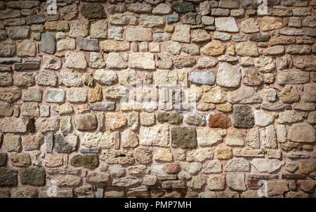 Teil einer Steinmauer, Hintergrund oder Textur. Stockfoto