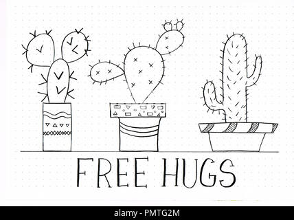 'Free Hugs' Hand Schriftzug Phrase mit doodles von niedlichen catuctuses in verschiedenen Blumentöpfe Stockfoto