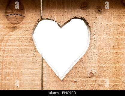 Herz carved in dunklem Holz Wand Textur, mit bokeh Hintergrund isoliert Stockfoto
