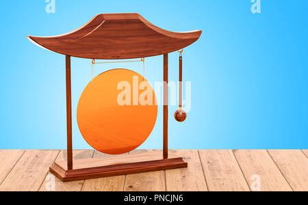 Goldene Gong auf dem Holztisch. 3D-Rendering Stockfoto