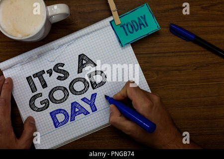 Schreiben Hinweis, es ist ein guter Tag. Business Foto präsentieren glückliche Zeit tolle Stimmung perfekt Leben schön Hand halten pen Tasse Blu Stockfoto