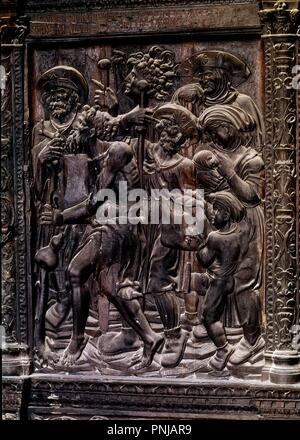 PEREGRINOS EN EL CAMINO DE SANTIAGO - ENTLASTEN EN MADERA DE ROBLE DE LA PUERTA DE ACCESO A LA CAPILLA DE LA IGLESIA DEL HOSPITAL DEL REY - SIGLO XVI. Autor: BALMASEDA JUAN DE. Lage: HOSPITAL DEL REY. BURGOS. Spanien. Stockfoto