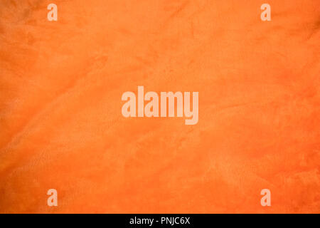 Jersey bright orange Stoff mit leichten Falten closeup, können als Hintergrund oder Textur verwendet werden. Stockfoto