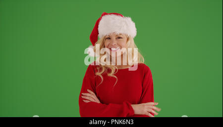 Fröhliche kaukasische Frau in Weihnachten Kleidung auf Green Screen posing Stockfoto