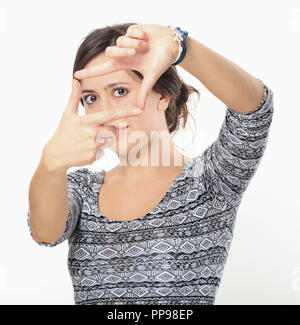 Schöne Brünette, finger Frame Stockfoto