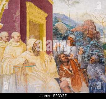 Fresko im Kloster von Monte Oliveto Maggiore, in der Nähe von Siena, Toskana, Italien, zeigt eine Szene aus dem Leben des Hl. Benedikt Stockfoto
