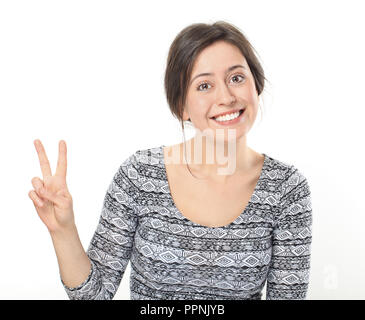 Lächelnden jungen Frau, Sieg und Frieden Stockfoto