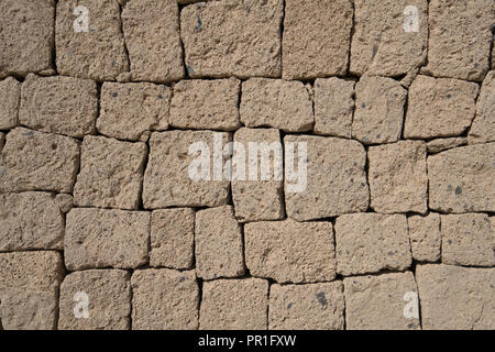 Ignimbrite Steinmauer - Naturstein Wand Hintergrund, Stockfoto