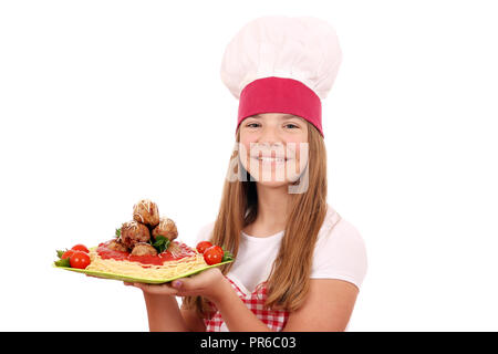 Happy girl Kochen mit Spaghetti und Frikadellen auf Platte Stockfoto