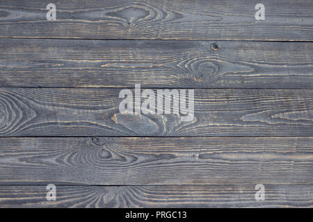 Dunkler Hintergrund Textur aus Holz Bretter mit farbresten. Stockfoto