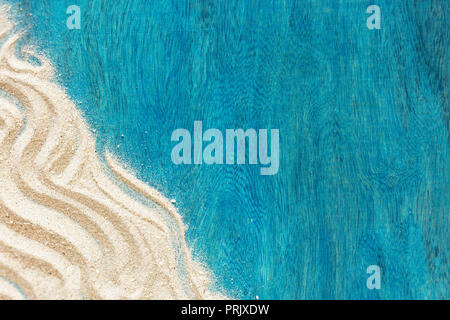Summer time concept with starfish and sand on a blue wooden background Stockfoto