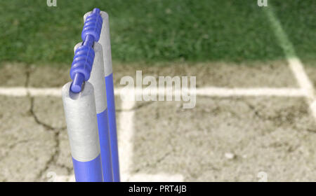 Eine Reihe von Blue cricket Wickets, die auf eine gerissene Rasenplatz Hintergrund - 3D-Rendering Stockfoto