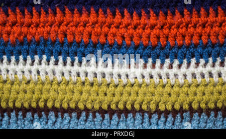 Mehrfarbig gestrickt gemütliche Textur closeup Hintergrund, das Konzept der Vielfalt Stockfoto