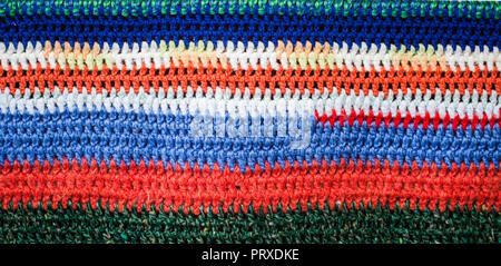 Mehrfarbig gestrickt gemütliche Textur closeup Hintergrund, das Konzept der Vielfalt Stockfoto