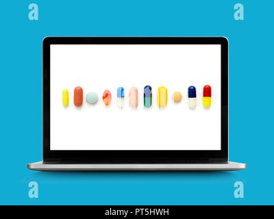 Tabletten auf Laptop überwachen. Stockfoto