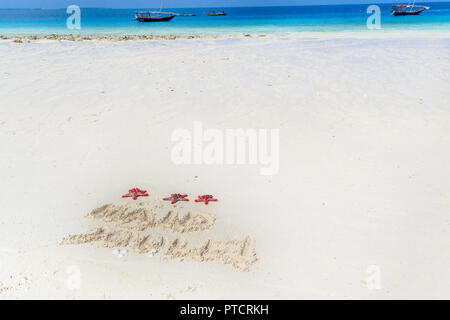 Frohe Weihnachten in Estnisch geschrieben auf dem Sand, Sansibar, nungwi Paradise Beach, Afrika Stockfoto