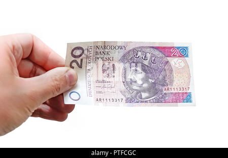 Schließen bis auf 20 Zloty Banknote in der Hand eines Mannes. Isoliertes Objekt auf weißem Hintergrund. Stockfoto