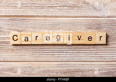 Betreuer Wort auf Holz Block geschrieben. Betreuer text auf Tisch, Konzept. Stockfoto