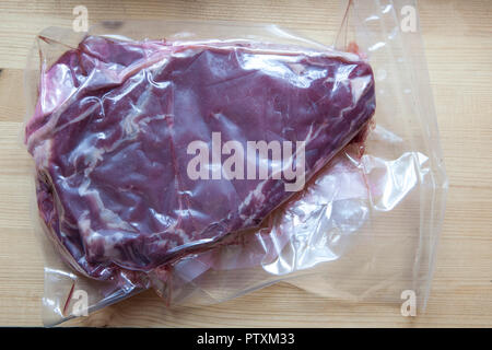 Steak unter Vakuum Stockfoto