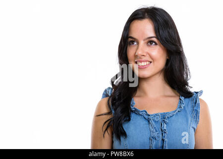 Studio shot der Jungen gerne schöne Spanische Frau lächelnd und t Stockfoto