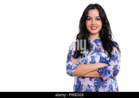 Studio shot der jungen spanischen Geschäftsfrau glücklich lächelnd mit Ar Stockfoto