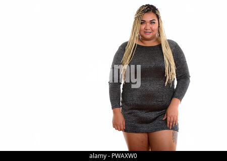 Studio shot der Jungen gerne Fett asiatische Frau lächelnd während standin Stockfoto