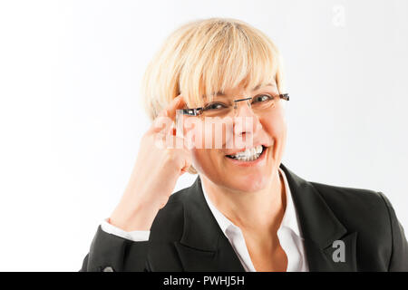 Reife Geschäftsfrau lächelnd Stockfoto