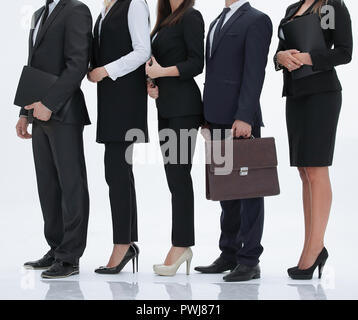 Bis zu schließen. Eine Gruppe junger Mitarbeiter in einer Zeile Stockfoto
