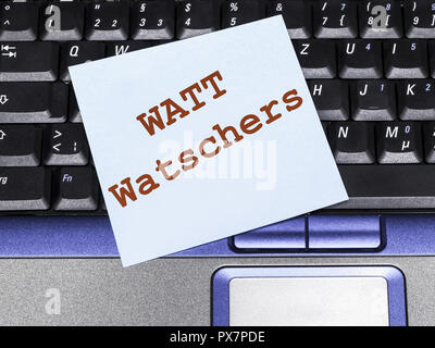 Memo Hinweis auf Notebook, watt Watchers Stockfoto