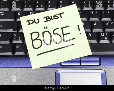 Memo-Hinweis auf Notebook, Du Bist Böse, du bist gemein Stockfoto