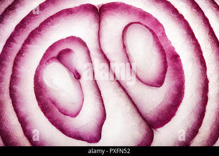 Abstrakte Food Art Muster von roten Zwiebeln Querschnitt in der Nähe fotografiert und Full Frame Stockfoto