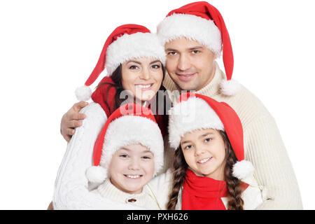 Familie mit Kindern in santa Hüte auf weißem Hintergrund Stockfoto