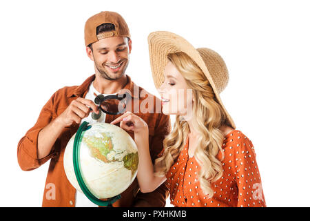 Glückliches Paar Auswahl auf Kugel isoliert auf weißem Stockfoto