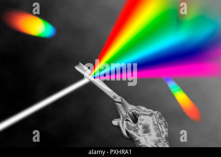 Ein Strahl von weißem Licht mit einer Schere geschnitten werden und in das Spektrum split Stockfoto