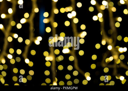 Abstrakte gold Bokeh auf dem schwarzen Hintergrund Stockfoto