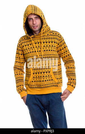Studio shot Junger stattlicher Mann stehend während Hoodie tragen Stockfoto