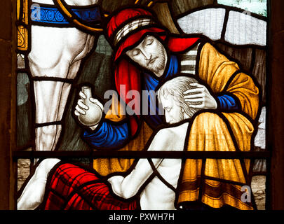 Der gute Samariter Glasmalerei detail, St. Dionysius Kirche, Market Harborough, Leicestershire, England, Großbritannien Stockfoto