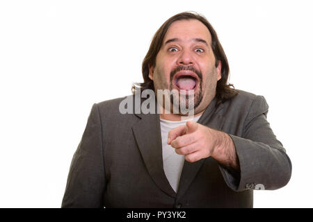 Gerne fett Kaukasischen Geschäftsmann Lächeln beim Lachen und Punkt Stockfoto