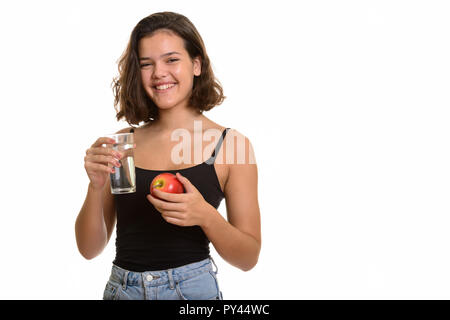 Junge glücklich Kaukasischen teenage Mädchen lächelnd, während sie Glas o Stockfoto