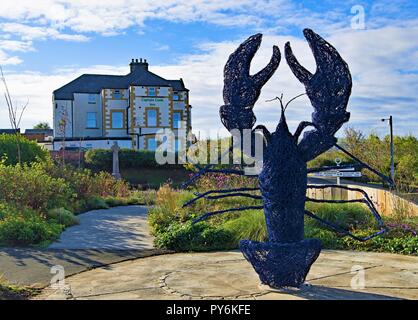 Die Erfassung der Eingang zu der einzigartigen Spaziergang zum Hafen von der North Yorkshire Fischerdorf Staithes. Stockfoto